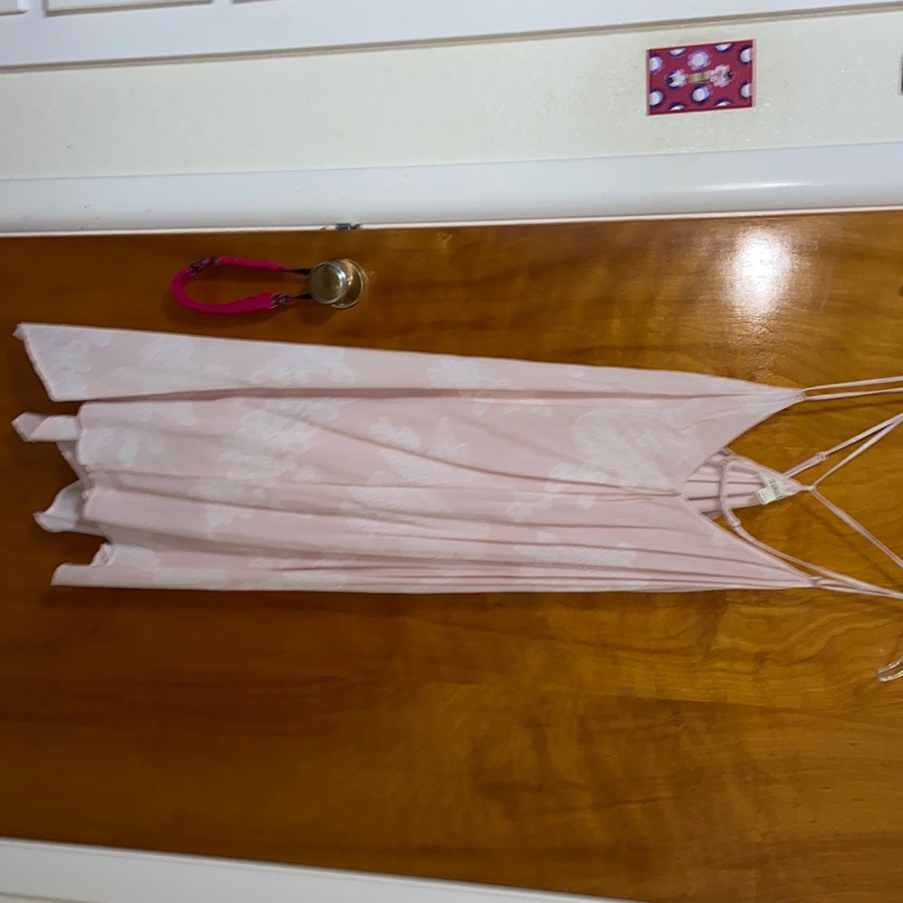 new without tags. cross cross back. adjustable straps.